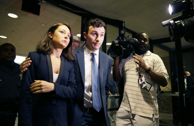 Former Cleveland Browns quarterback Johnny Manziel, right, and his sister Meri Manziel leave after he made his initial court appearance, Thursday, May 5, 2016, in Dallas. (LM Otero/AP)