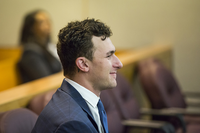 Former Cleveland Browns quarterback Johnny Manziel sits while his defense attorneys confer with the prosecution during his initial hearing, Thursday, May 5, 2016, in Dallas. (Smiley N. Pool/The Da ...