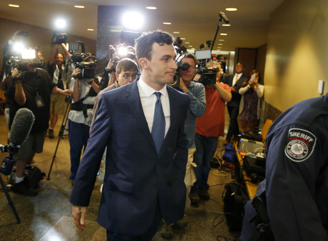 Former Cleveland Browns quarterback Johnny Manziel walks to the courtroom for his initial hearing, Thursday, May 5, 2016, in Dallas. The Heisman Trophy winner and former Texas A&M star was ind ...