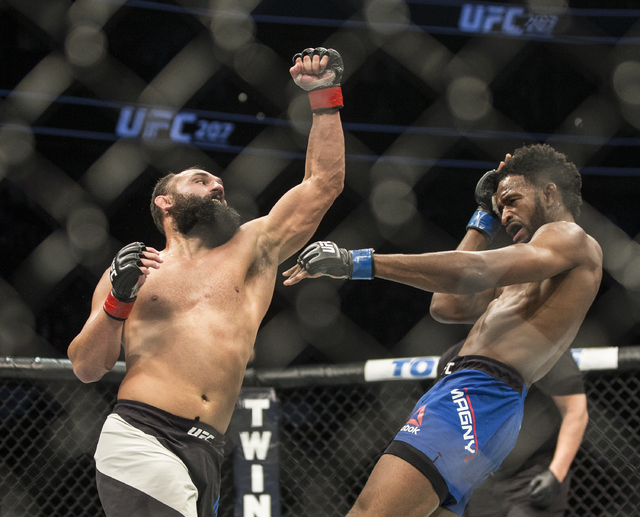 Johny Hendricks lands a strike against Neil Magny during their welterweight fight at UFC 207 at T-Mobile Arena on Friday, Dec. 30, 2016, in Las Vegas. Benjamin Hager/Las Vegas Review-Journal