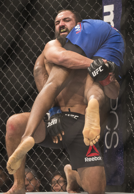 Johny Hendricks picks up and slams Neil Magny during their welterweight fight at UFC 207 at T-Mobile Arena on Friday, Dec. 30, 2016, in Las Vegas. Benjamin Hager/Las Vegas Review-Journal
