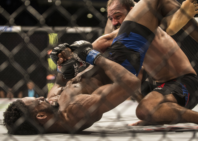 Neil Magny works an arm bar against Johny Hendricks during their welterweight fight at UFC 207 at T-Mobile Arena on Friday, Dec. 30, 2016, in Las Vegas. Benjamin Hager/Las Vegas Review-Journal