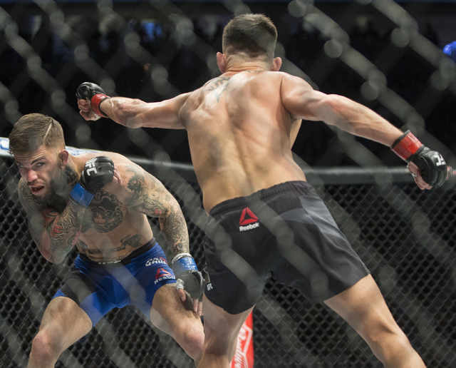 Cody Garbrandt, left, ducks a jab from Dominick Cruz during their bantamweight fight at UFC 207 at T-Mobile Arena on Friday, Dec. 30, 2016, in Las Vegas. Benjamin Hager/Las Vegas Review-Journal