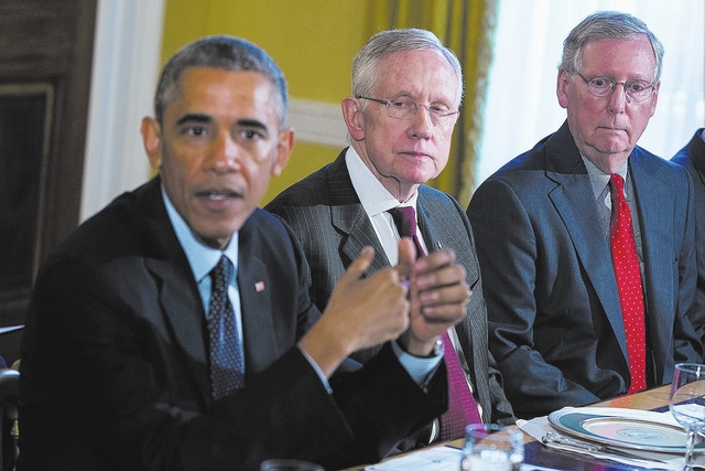 Senate Minority Leader Mitch McConnell of Ky., right, and Senate Majority Leader Harry Reid of Nev., center, listen as President Barack Obama speaks during a meeting with Congressional leaders in ...