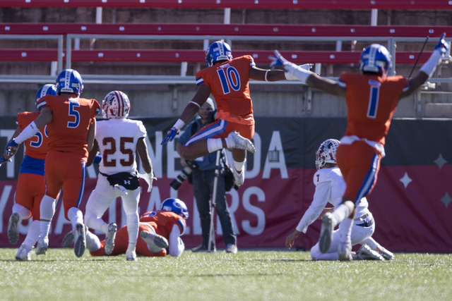 Bishop Gorman players celebrate a touchdown by Austin Arnold (6) against Liberty in the Class 4A state football championship game at Sam Boyd Stadium on Saturday, Dec. 3, 2016, in Las Vegas. Bisho ...