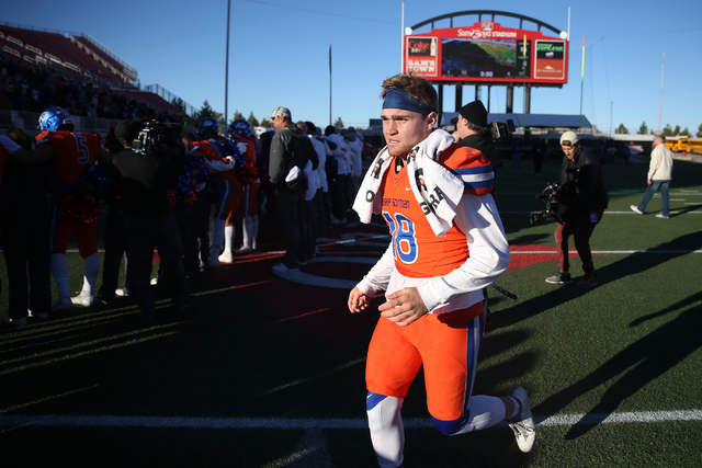 Bishop Gorman's Tate Martell (18) runs to meet with his teammates after winning 84-8 against Liberty in the Class 4A state football championship game at Sam Boyd Stadium on Saturday, Dec. 3, 2016, ...