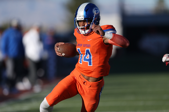 Bishop Gorman's Dorian Thompson-robinson(14) runs for a touchdown against Liberty in the Class 4A state football championship game at Sam Boyd Stadium on Saturday, Dec. 3, 2016, in Las Vegas. Bish ...