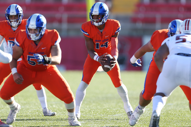 Bishop Gorman's Dorian Thompson-Robinson (14) takes a snap ball against Liberty in the Class 4A state football championship game at Sam Boyd Stadium on Saturday, Dec. 3, 2016, in Las Vegas. Bishop ...