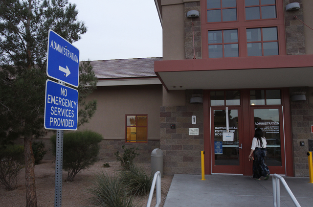 A woman walks into the Rawson-Neal Psychiatric Hospital in Las Vegas Friday, Jan. 24, 2014. The outpatient clinic at the hospital closed down. (John Locher/Las Vegas Review-Journal)