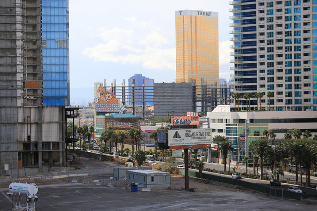 The skeleton of the unfinished Resorts World hotel-casino is seen between the unfinished Fontainebleau, left, and the Trump International on the Strip in Las Vegas on Friday, Dec. 23, 2016. The Ri ...