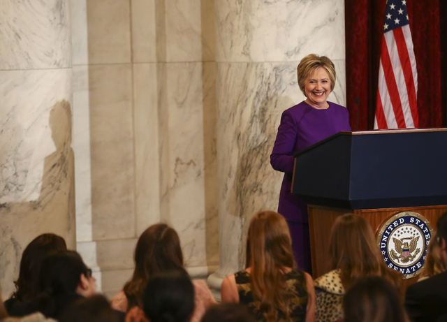Former Secretary of State Hillary Clinton speaks during a ceremony to unveil a portrait of Senate Minority Leader Harry Reid, D-Nev., on Capitol Hill in Washington D.C. on Thursday, Dec. 8, 2016.  ...