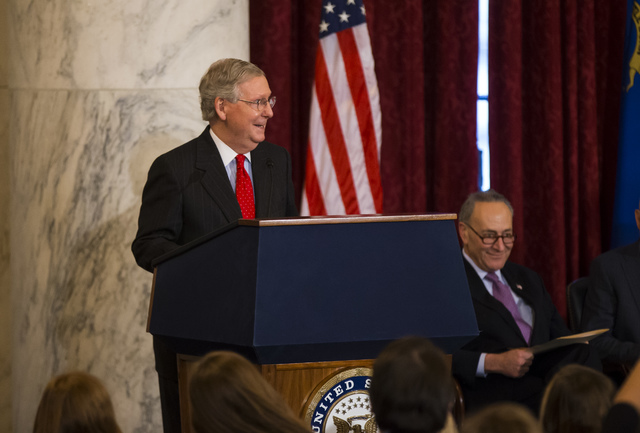 Senate Majority Leader Mitch McConnell, R-Ky., speaks during a ceremony to unveil a portrait of Senate Minority Leader Harry Reid, D-Nev., on Capitol Hill in Washington D.C. on Thursday, Dec. 8, 2 ...