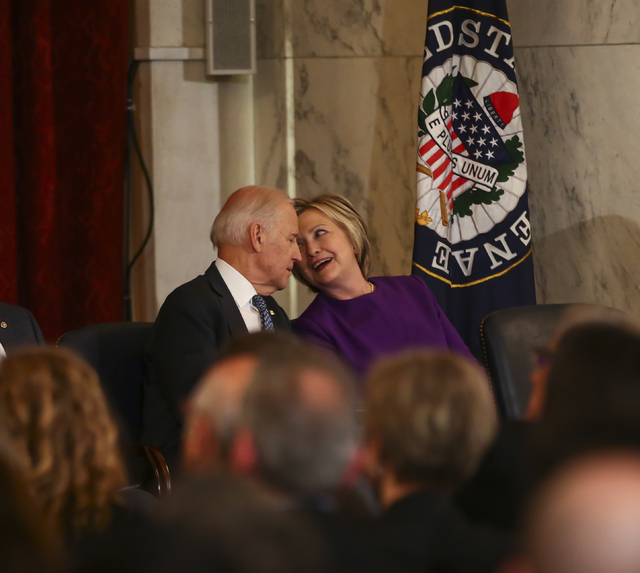 Vice President Joe Biden and former Secretary of State Hillary Clinton during a ceremony to unveil a portrait of Senate Minority Leader Harry Reid, D-Nev., on Capitol Hill in Washington D.C. on Th ...