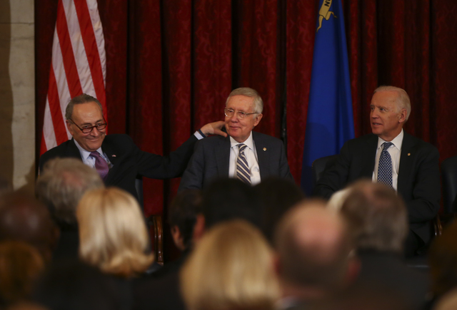 Incoming Senate Minority Leader Sen. Charles Schumer, D-N.Y., from left, Senate Minority Leader Harry Reid, D-Nev., and Vice President Joe Biden during a ceremony to unveil Reid's portrait on Capi ...