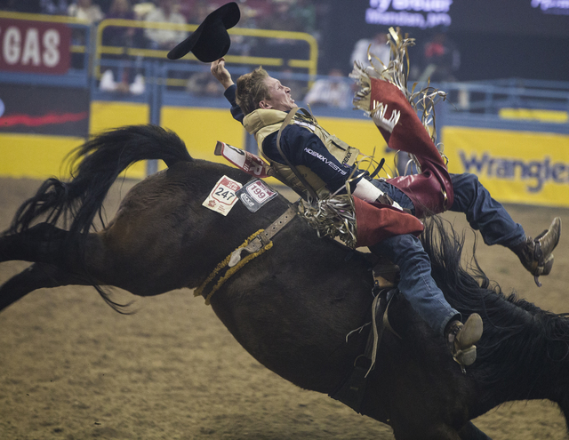 Ty Breuer rides True Grit during the bareback riding competition on the ninth day of the National Finals Rodeo at the Thomas & Mack Center on Friday, Dec. 9, 2016, in Las Vegas. Benjamin Hager ...