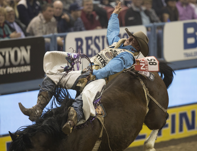 J.R. Vezain rides Cool Boots during the bareback riding competition on the ninth day of the National Finals Rodeo at the Thomas & Mack Center on Friday, Dec. 9, 2016, in Las Vegas. Benjamin Ha ...
