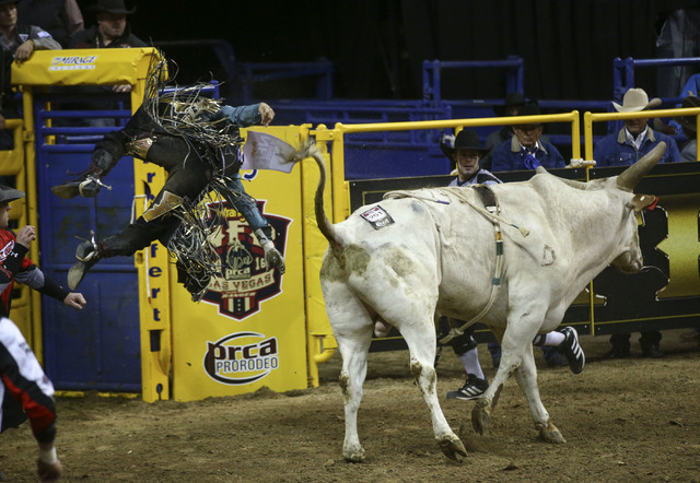 Sage Kimzey is bucked off of Breaking Bad while competing in the bull riding event during the 2nd go-round of the National Finals Rodeo at the Thomas & Mack Center in Las Vegas on Friday, Dec. ...