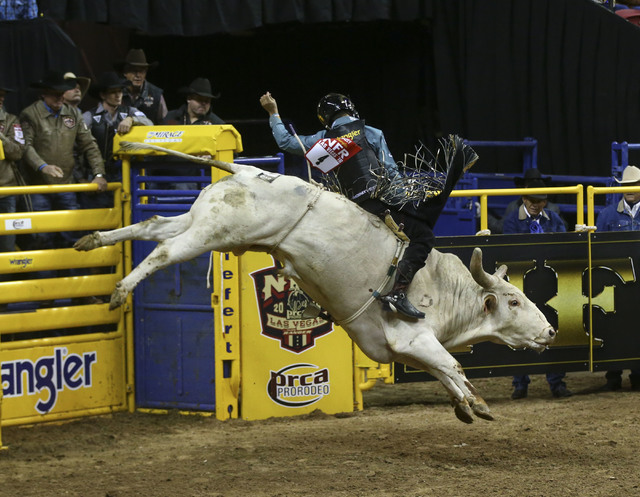 Sage Kimzey rides Breaking Bad while competing in the bull riding event during the 2nd go-round of the National Finals Rodeo at the Thomas & Mack Center in Las Vegas on Friday, Dec. 2, 2016. ( ...