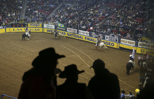 Attendees take their seats at the start of the 2nd go-round of the National Finals Rodeo at the Thomas & Mack Center in Las Vegas on Friday, Dec. 2, 2016. (Chase Stevens/Las Vegas Review-Journ ...