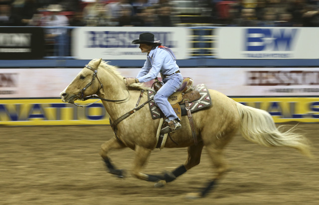 Mary Burger competes in the barrel racing event during the 2nd go-round of the National Finals Rodeo at the Thomas & Mack Center in Las Vegas on Friday, Dec. 2, 2016. (Chase Stevens/Las Vegas  ...
