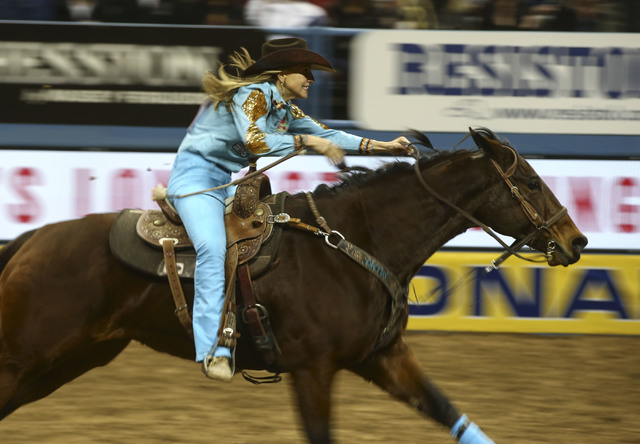 Kimmie Wall competes in the barrel racing event during the 2nd go-round of the National Finals Rodeo at the Thomas & Mack Center in Las Vegas on Friday, Dec. 2, 2016. (Chase Stevens/Las Vegas  ...