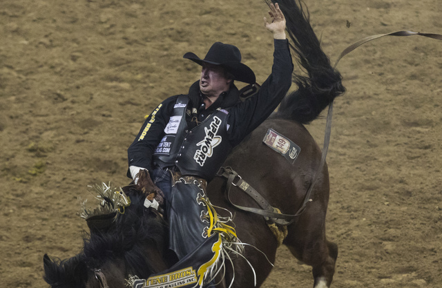 Jake Vold competes during the bareback riding competition on the final night of the National Finals Rodeo at the Thomas & Mack Center in Las Vegas on Saturday, Dec. 9, 2016. (Miranda Alam/Las  ...