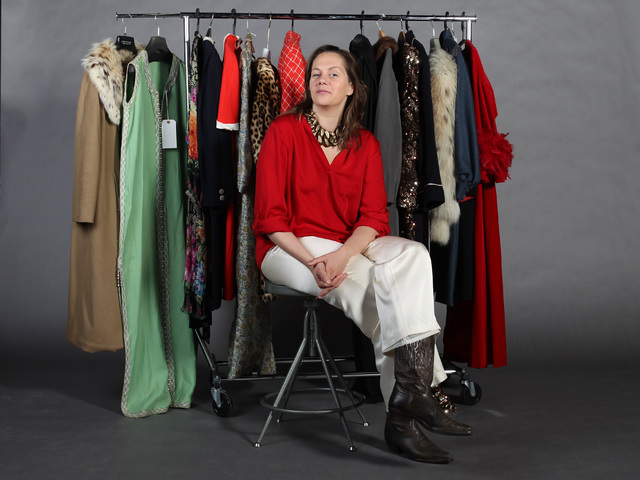 UNLV history professor Deirdre Clemente is seen with a selection of clothing from the collection of former actress Corinne Sidney. (Sam Morris/Las Vegas Review-Journal)