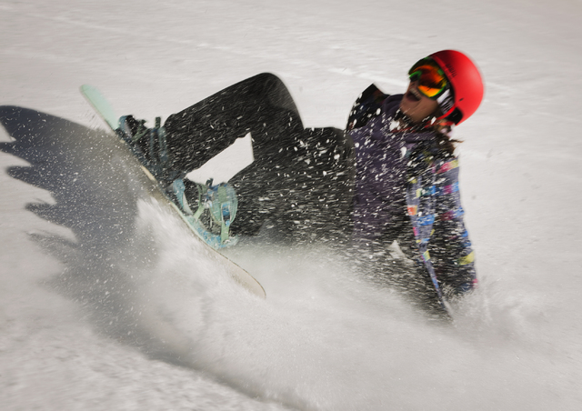Snowboarder Rylie Backus of Clarkdale, Arizona, takes a fall at Arizona Snowbowl on March 5, 2016. The resort, just outside of Flagstaff, has been in operation since 1938, making it one of the lon ...