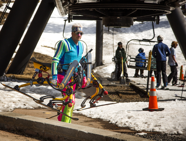 A man carries ski trikes at Arizona Snowball on March 5, 2016. The resort is just outside of Flagstaff and has been in operation since 1938, making it one of the longest continually running ski re ...