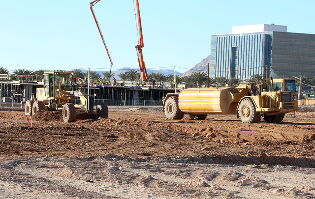 Heavy-duty, earth-moving equipment at the site at the site where Summerlin developer Howard Hughes Corp. has plans to build an office tower next to the new NHL practice rink in Summerlin on Tuesda ...