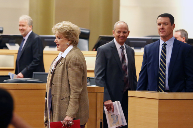 Las Vegas Mayor Carolyn Goodman, arrives at the council chambers with Pat Egan, NV Energy senior vice president of customer operations, right, and Tom Perrigo, planning director and chief sustaina ...
