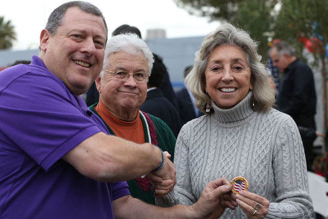 Publisher and editor of National Veterans Magazine, Mark Field, left, greets Councilman Bob Coffin and Rep. Dina Titus at the opening ceremony and ribbon cutting for the second Veterans Village in ...