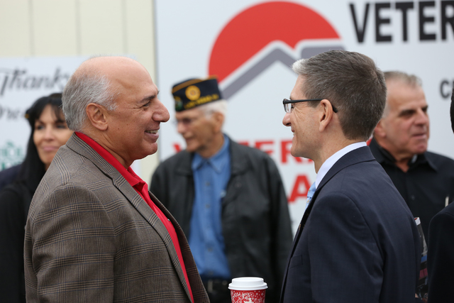 Councilman Stavros S. Anthony, left, and Rep. Joe Heck chat during the grand opening and ribbon cutting ceremony for the second Veterans Village in downtown Las Vegas on Thursday, Dec.15, 2016. (M ...