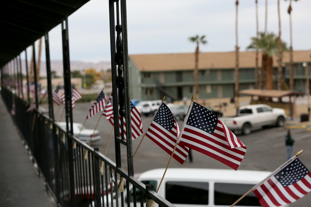 Flags decorate the railing of another 204 units of housing at Veterans Village second location which includes a crisis intervention center and a food pantry for homeless veterans in downtown Las V ...