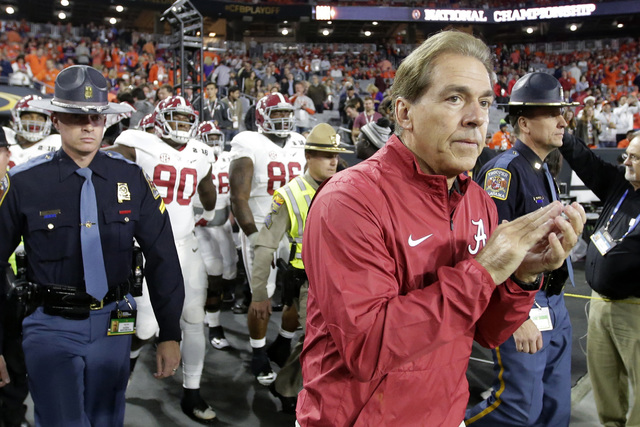 Alabama coach Nick Saban makes his way to the field before the NCAA college football playoff championship game against Clemson on Jan. 11, 2016, in Glendale, Ariz. (AP Photo/Chris Carlson)