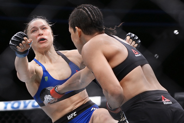 Amanda Nunes lands a strike against Ronda Rousey during their bantamweight championship fight at UFC 207 at T-Mobile Arena on Friday, Dec. 30, 2016, in Las Vegas. Benjamin Hager/Las Vegas Review-J ...