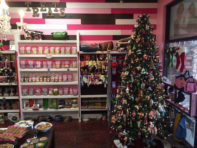 A Christmas tree in front of the treat wall inside Woof Gang Bakery & Grooming in Las Vegas on Wednesday, Dec. 21, 2016. (Raven Jackson/Las Vegas Review-Journal) @ravenmjackson