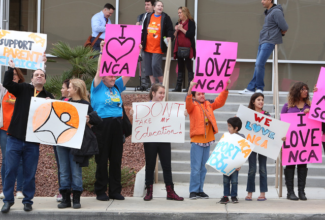 Parents and students supporting the online Nevada Connections Academy charter school protest outside the Nevada System of Higher Education building on Friday, Dec. 16, 2016, in Las Vegas. (Bizuaye ...