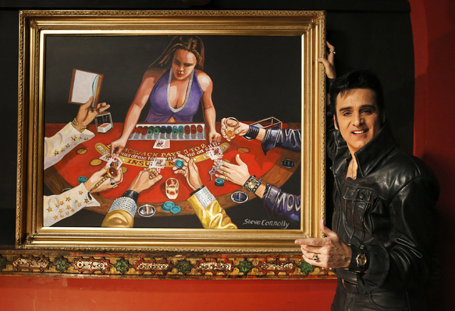 Steve Connolly, who performs as Elvis in "Spirit of the King", with his painting (acrylic on wood) at Four Queens hotel-casino on Saturday, Dec. 17, 2016 in Las Vegas. According ...