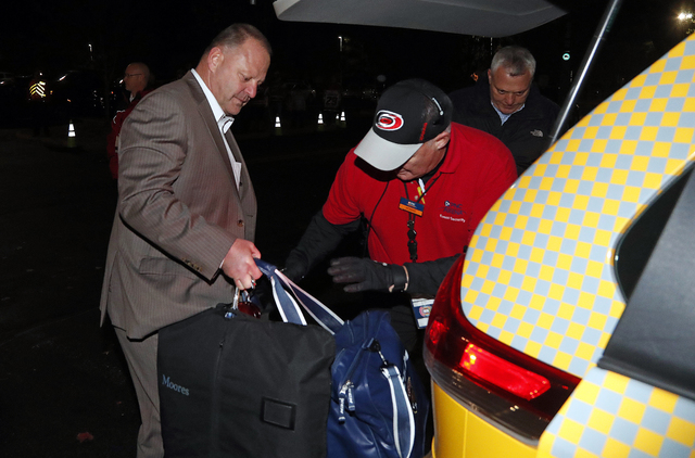 Gerard Gallant, former Florida Panthers head coach, gets into a cab after being relieved of his duties following an NHL hockey game against the Carolina Hurricanes, Sunday, Nov. 27, 2016, in Ralei ...