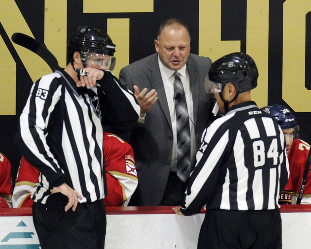 Florida Panthers head coach Gerard Gallant talks with the officials on the ice while playing New Jersey Devils during an NHL preseason hockey game, Saturday, Oct. 8, 2016, in West Point, N.Y. The  ...