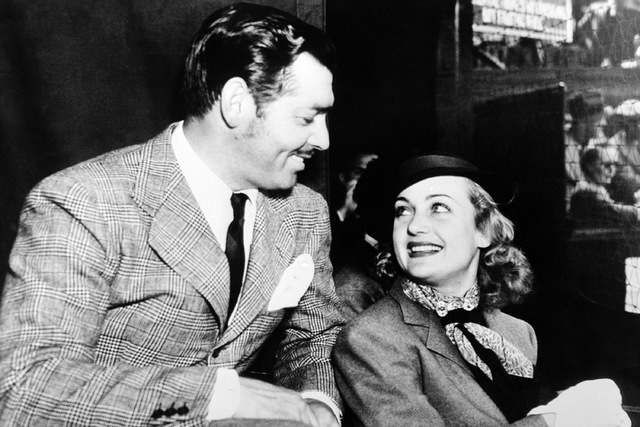 Hollywood saw romance behind Carole Lombard's appearance in Los Angeles court to have her screen name legalised. Carole Lombard and Clark Gable watching a lawn tennis match together on Nov. 13, 19 ...