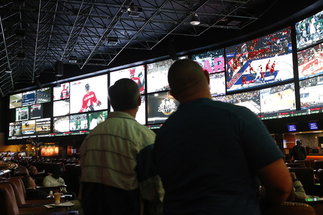 Betters looks at a tv screen before the Westgate sports book posted nearly 400 Super Bowl prop bets on Thursday, Jan. 26, 2017, in Las Vegas. (Christian K. Lee/Las Vegas Review-Journal) @chrisklee ...