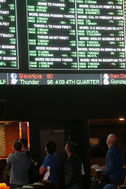 Betters looks at a tv screen while standing in line to place their bets at the Westgate sports book on Thursday, Jan. 26, 2017, in Las Vegas. (Christian K. Lee/Las Vegas Review-Journal) @chrisklee ...