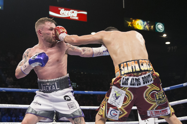Leo Santa Cruz, right, connects a punch against Carl Frampton in the WBA Featherweight Championship bout at MGM Grand Garden Arena on Saturday, Jan. 28, 2017, in Las Vegas. Santa Cruz won by split ...