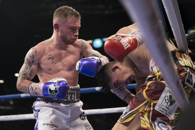 Carl Frampton, left, battles Leo Santa Cruz in the WBA Featherweight Championship bout at MGM Grand Garden Arena on Saturday, Jan. 28, 2017, in Las Vegas. Santa Cruz won by split decision. (Erik V ...