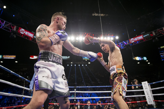 Carl Frampton, left, battles Leo Santa Cruz in the WBA Featherweight Championship bout at MGM Grand Garden Arena on Saturday, Jan. 28, 2017, in Las Vegas. Santa Cruz won by split decision. (Erik V ...