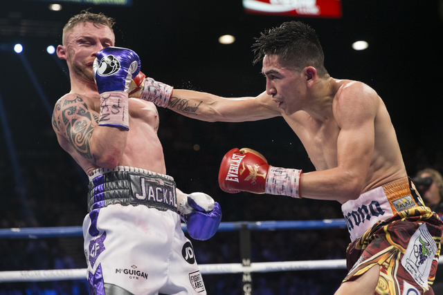 Leo Santa Cruz, right, connects a punch against Carl Frampton in the WBA Featherweight Championship bout at MGM Grand Garden Arena on Saturday, Jan. 28, 2017, in Las Vegas. Santa Cruz won by split ...