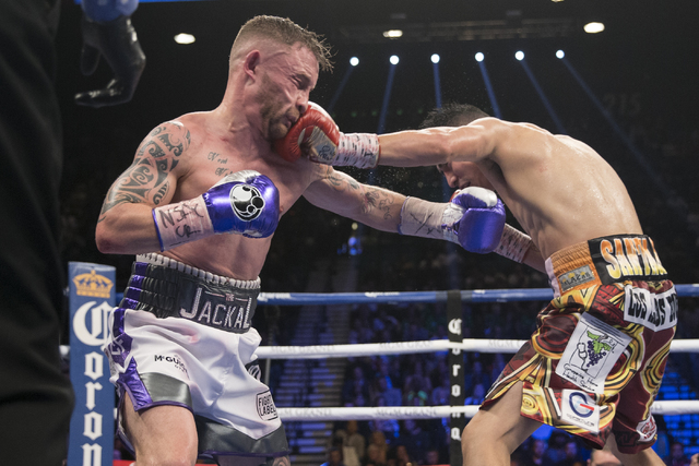 Leo Santa Cruz, right, connects a punch against Carl Frampton in the WBA Featherweight Championship bout at MGM Grand Garden Arena on Saturday, Jan. 28, 2017, in Las Vegas. Santa Cruz won by split ...