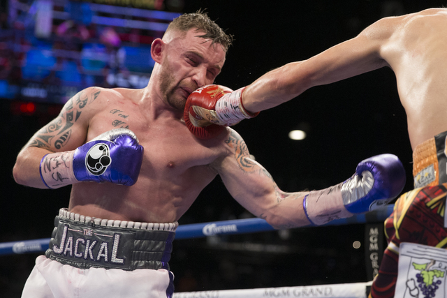 Leo Santa Cruz, right, connects a punch against Carl Frampton in the WBA Featherweight Championship bout at MGM Grand Garden Arena on Saturday, Jan. 28, 2017, in Las Vegas. Santa Cruz won by split ...